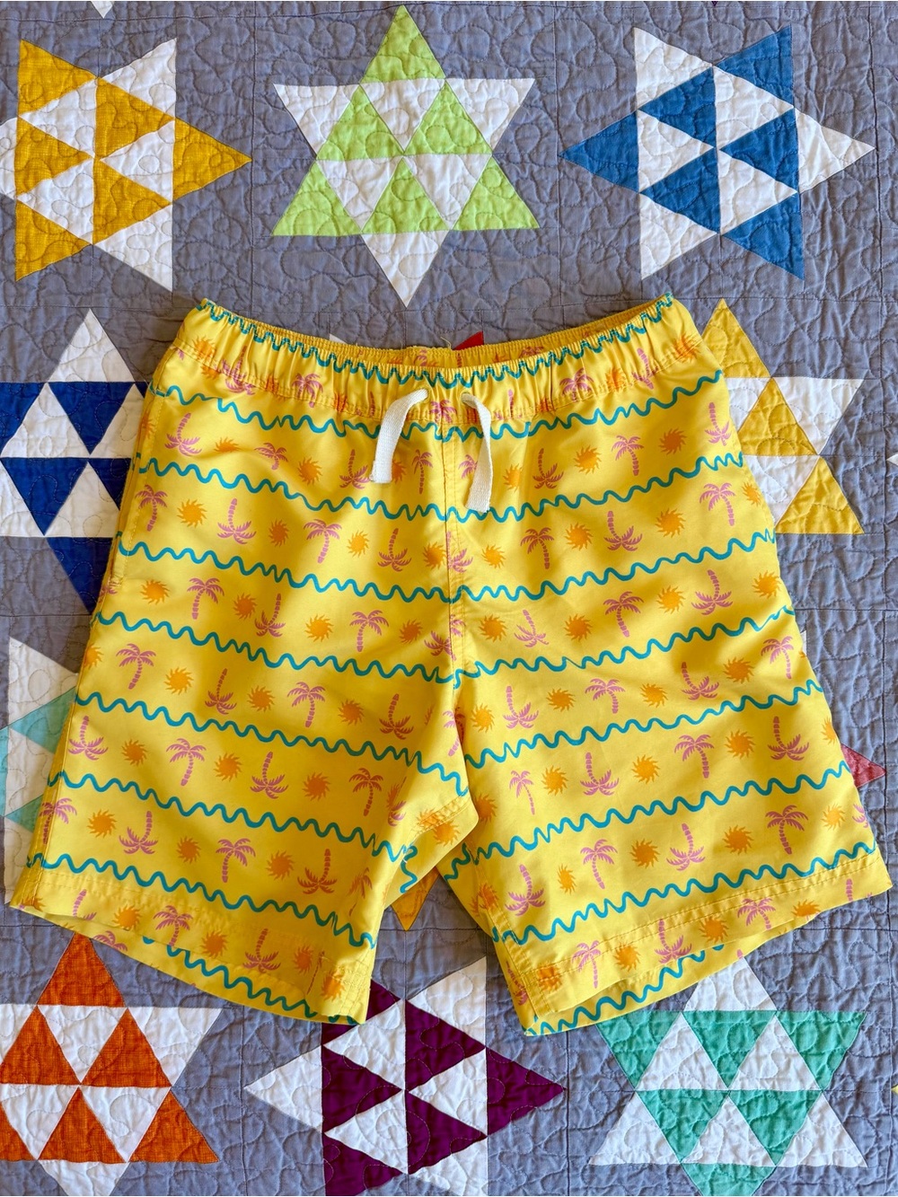 Hanna Andersson Yellow Palm-Print Swim Shorts with Teal Wave Stripes